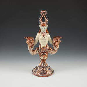 Candelabro a due braccia a forma di figura mitologica